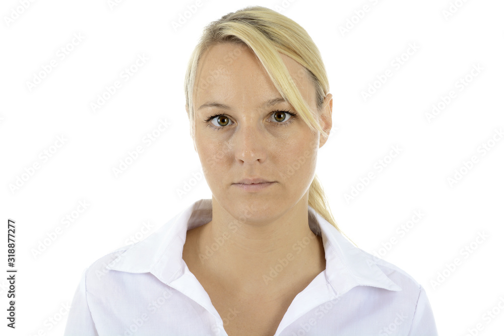 Portrait of a young woman in white blouse looks serious and vulnerable in the studio isolated on white Portrait of a young woman in white blouse looks serious and vulnerable in the studio isolated on white