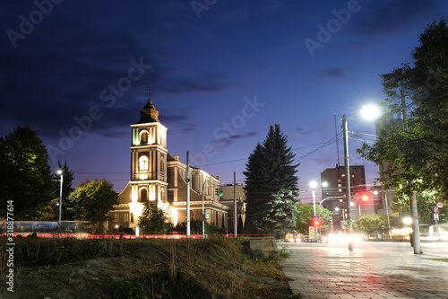 Night city church on light background. Old town. Scenic cityscape.