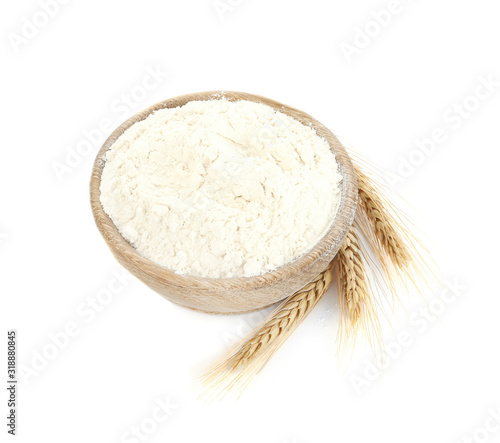 Organic flour and spikelets isolated on white