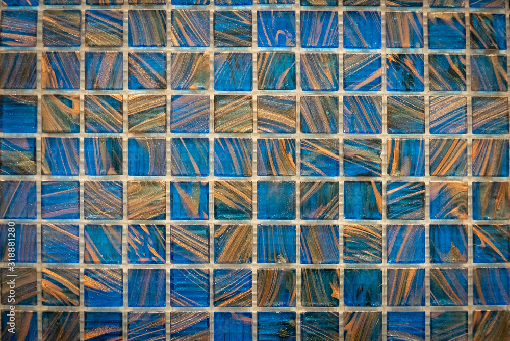 Fototapeta premium Brown and blue ceramic mosaic on the wall as background