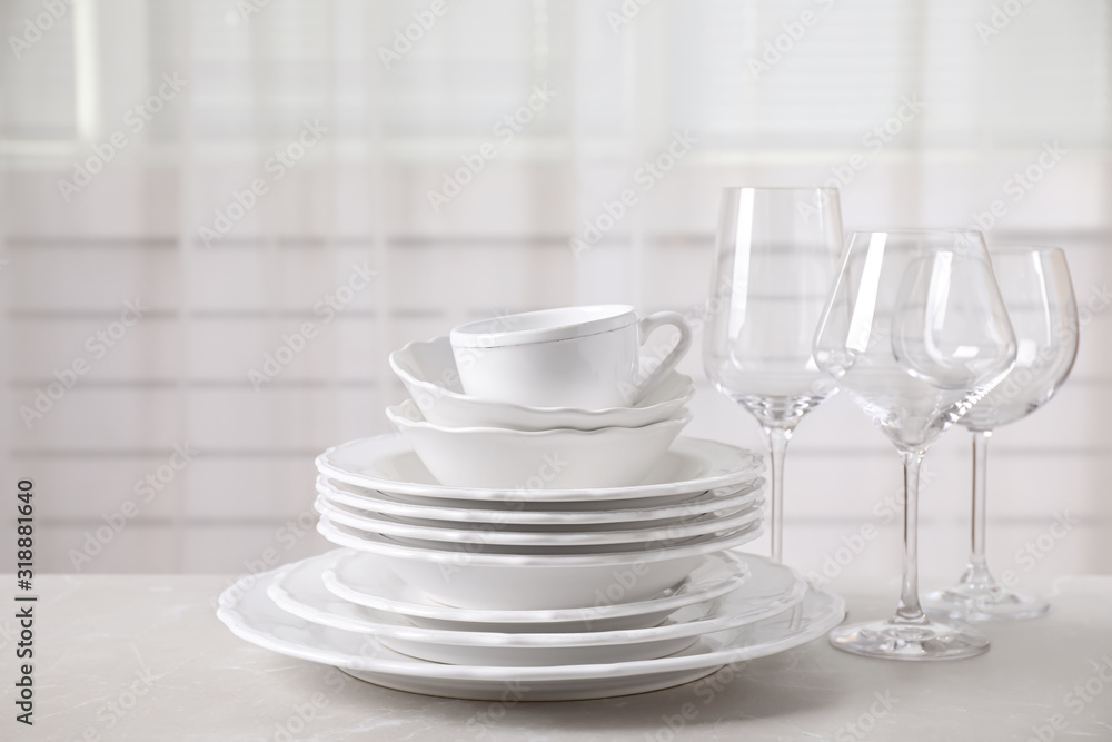 Set of clean tableware on light grey marble table Set of clean tableware on light grey marble table