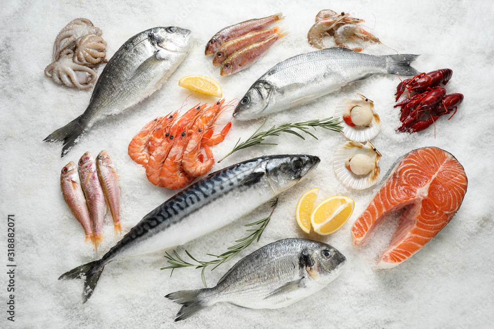 Fresh fish and seafood on ice, flat lay - obrazy, fototapety, plakaty 