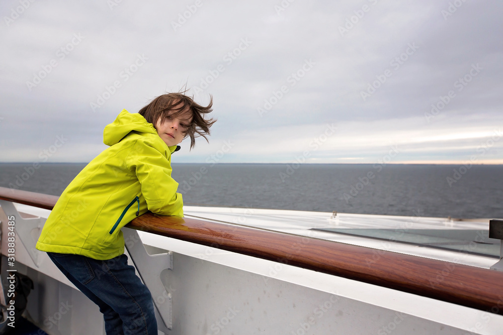Children, playing on a ferry boat while traveling