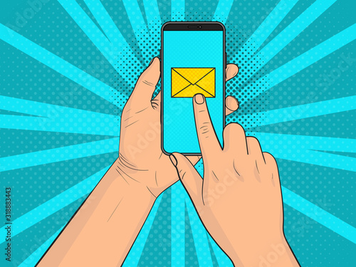 A hand with a smartphone. Finger clicks on the letter icon. Pop Art vintage vector illustration