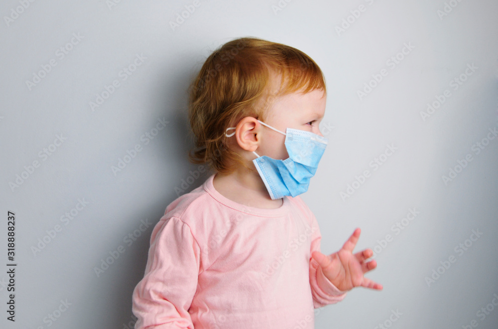 one healthy little baby crying. Medical mask on the baby. protect the child from diseases. stop the spread of the virus. wear a surgical mask. one healthy little baby crying. Medical mask on the baby. protect the child from diseases. stop the spread of the virus. wear a surgical mask.