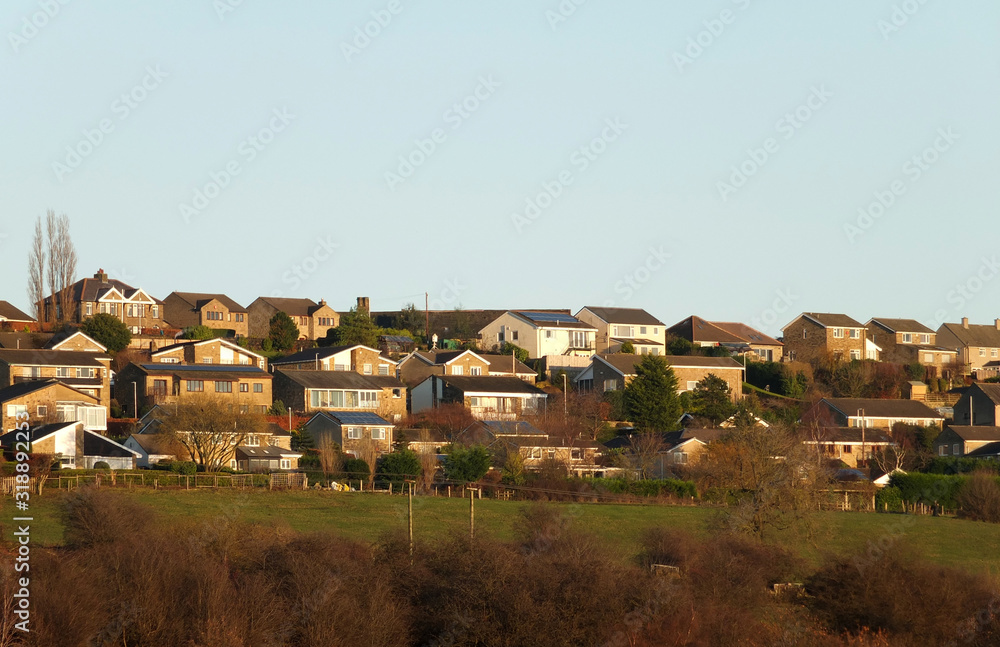 streets of typical modern suburban british houses on a hillside on the outskirts of brighouse in west yorkshire streets of typical modern suburban british houses on a hillside on the outskirts of brighouse in west yorkshire