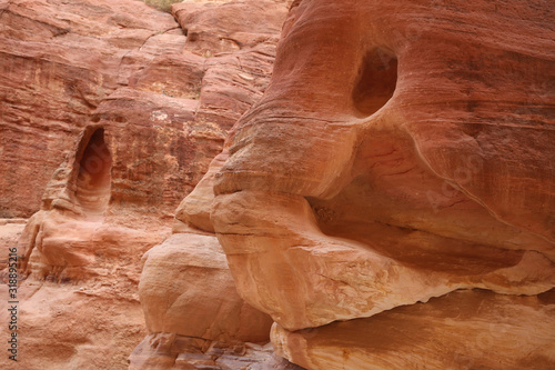 Red rock with a face, as you walk down the Siq towards Petra, Jordan.