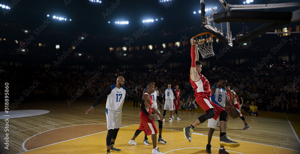 Fototapeta premium Basketball players on big professional arena during the game. Tense moment of the game.