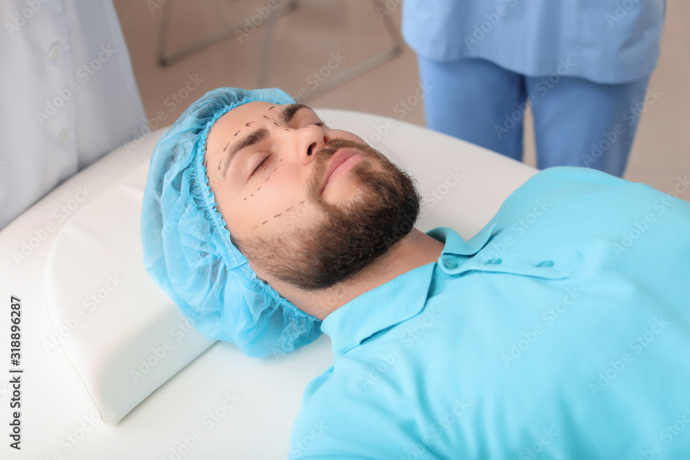 Handsome man in clinic of plastic surgery Handsome man in clinic of plastic surgery