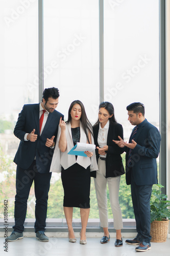 vertical business background of group of businesspeople standing together and having business discussion