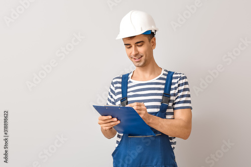 Handsome male worker with c...