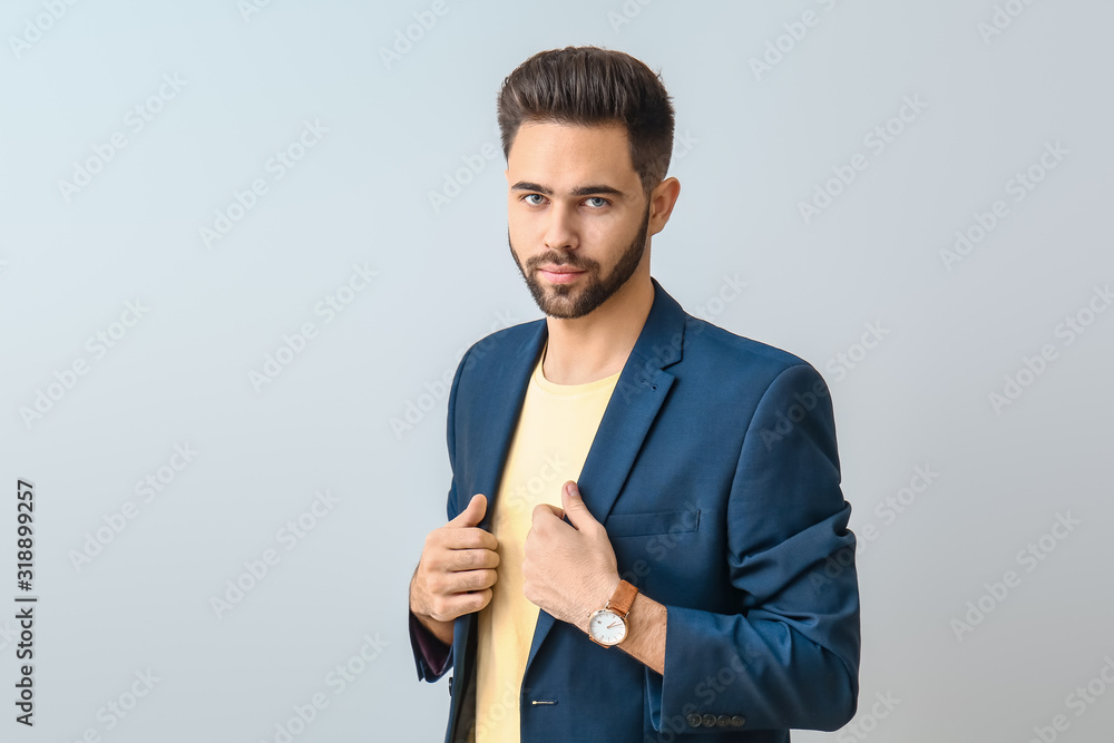 Handsome young man on light background Handsome young man on light background