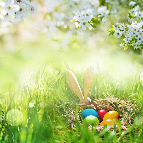 Meadow with colorful easter eggs