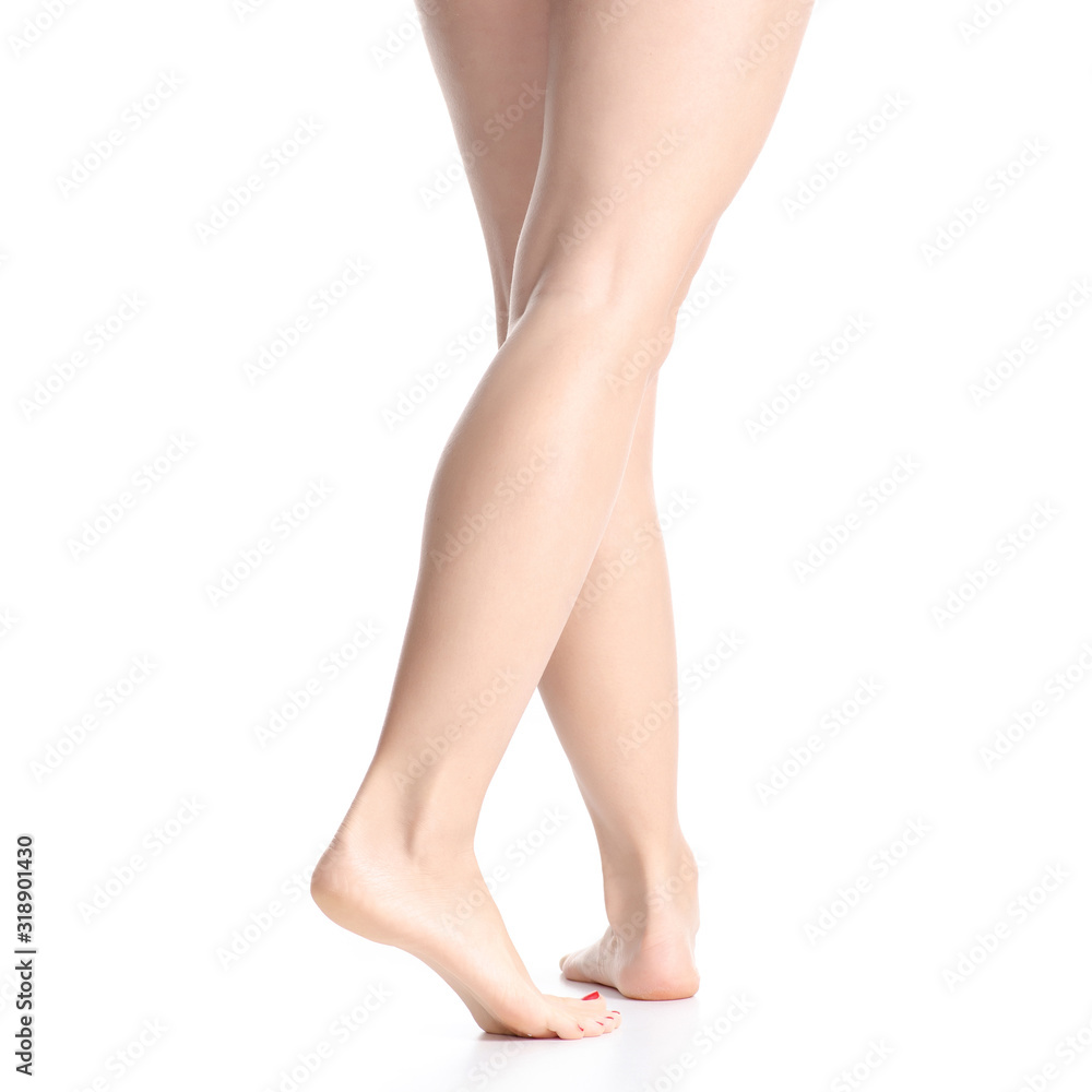 Woman female legs feet goes beauty on white background isolation Woman female legs feet goes beauty on white background isolation