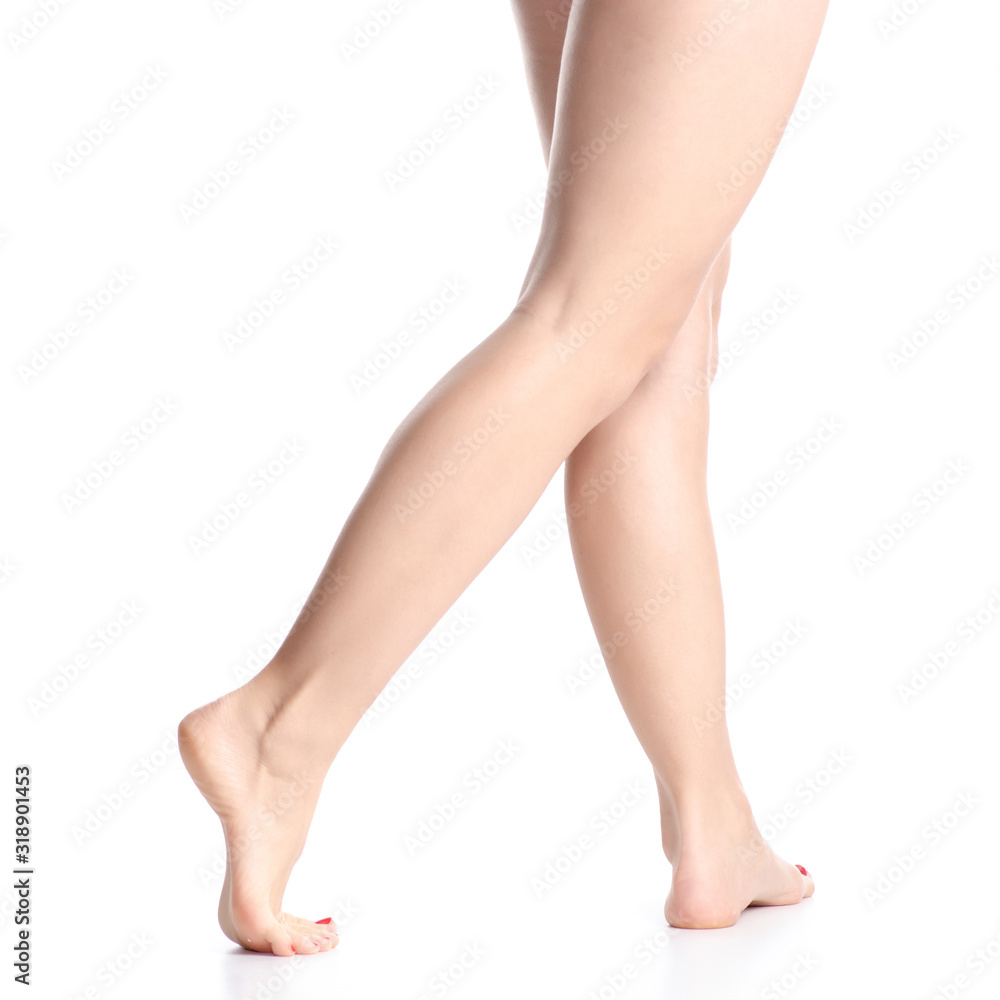 Woman female legs feet goes beauty on white background isolation Woman female legs feet goes beauty on white background isolation