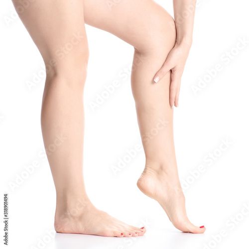 Woman female legs feet goes beauty on white background isolation © Kabardins photo
