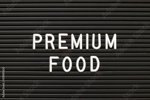 Black color felt letter board with white alphabet in word premium food background