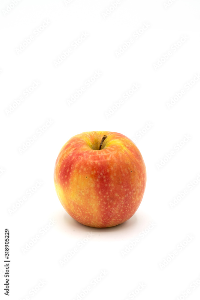 naturally yellow, red apple isolated from a white background naturally yellow, red apple isolated from a white background