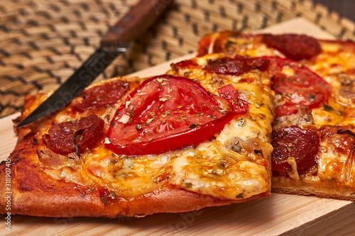 Cheese  tomato and sausage pizza