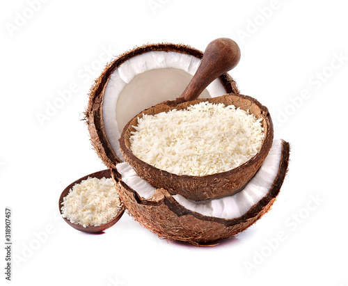 Coconut flakes in wooden bowl isolated on white background. Coconut with coconut flakes closeup.