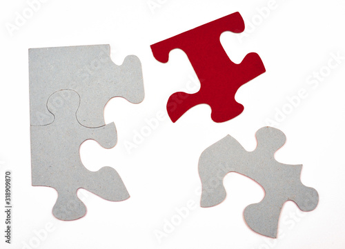Puzzle pieces grey, on part in red, concept, symbol background isolated