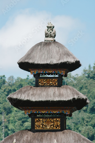 UBUD,INDONESIA - JULY 27,2009: TOURIST VISITS THE Floating temple or Pura Ulun Danu temple on a lake Beratan. Bali Indonesia photo