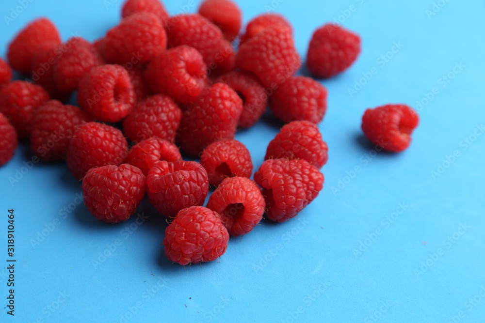 delicious raspberries in colorful background delicious raspberries in colorful background