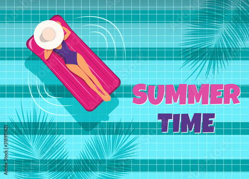 The young woman swims in the pool top view. A woman swims in a pool on an air mattress, enjoying summer vacation. Summer time.