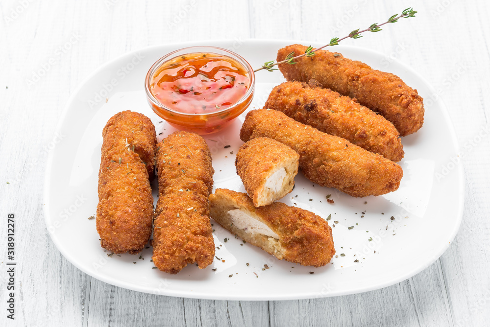 Fried chicken nuggets with ketchup on a plate Fried chicken nuggets with ketchup on a plate