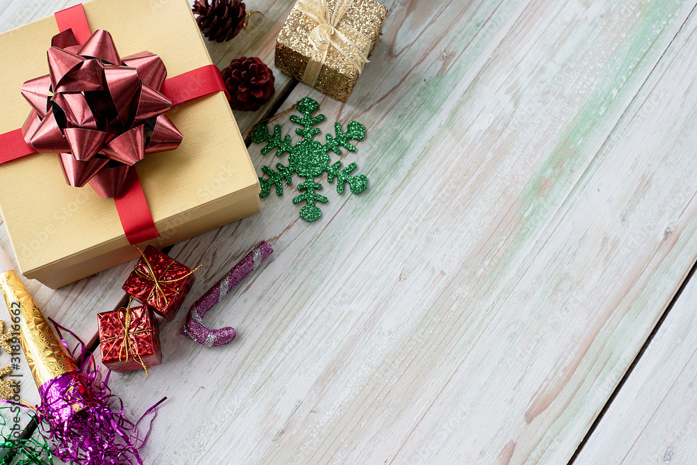 Flat lay of gift box and decoration object on wood background. Christmas and celebrations concept. Flat lay of gift box and decoration object on wood background. Christmas and celebrations concept.