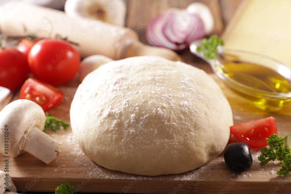 raw dough pizza with oil, tomato, olive and mushroom raw dough pizza with oil, tomato, olive and mushroom