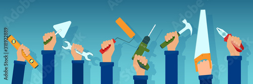 Vector of workers holding repair tools in their hands