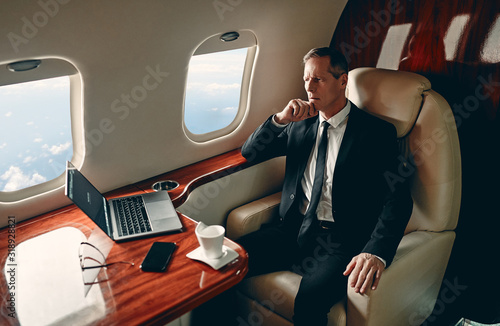 Photos Businessman in private jet
