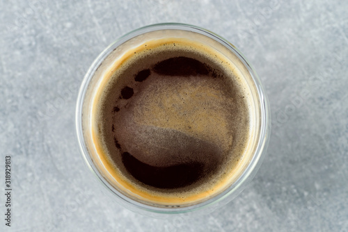 americano coffee in a glass close-up on a gray background