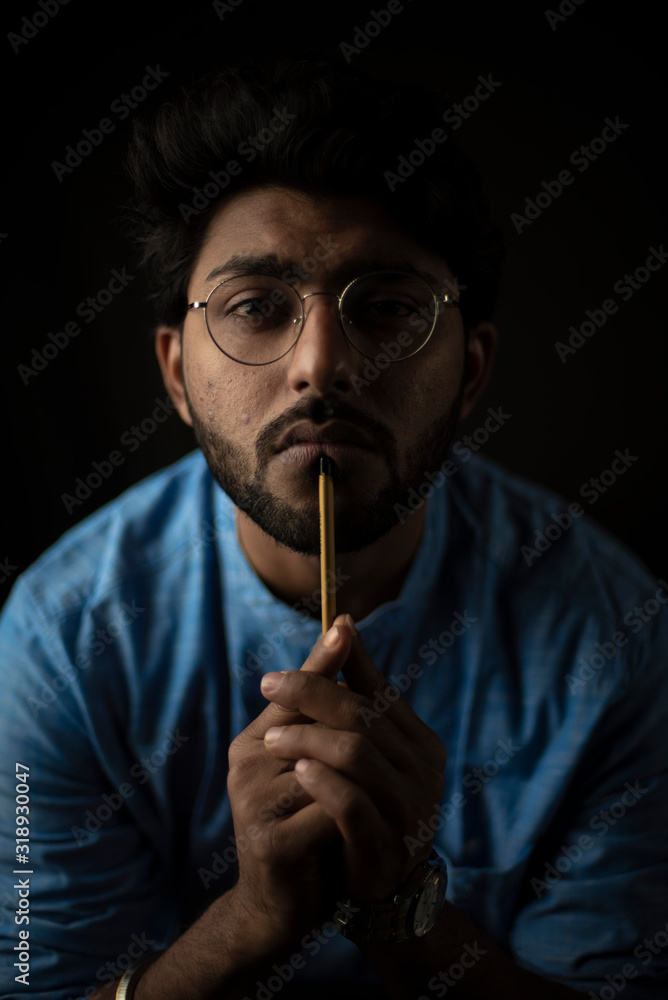 Portrait of young and handsome Indian Bengali man with