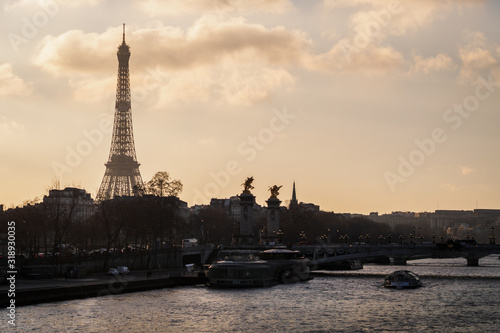 View of Paris at sunset with the Eiffel Tower and the bridge Alexander III - Paris, France