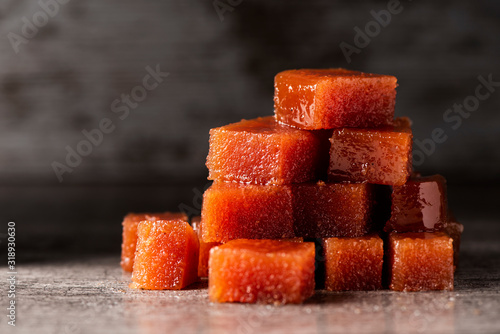 dices of quince cheese on a table