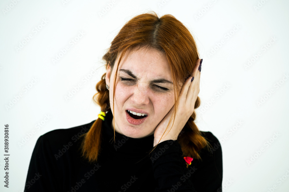 Portrait of a young woman having ear pain. Portrait of a young woman having ear pain.