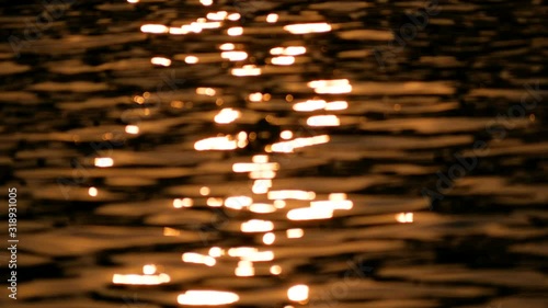 Abstract blurred bokeh background of the water in twilight