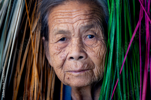 Face of elderly Asian woman close up