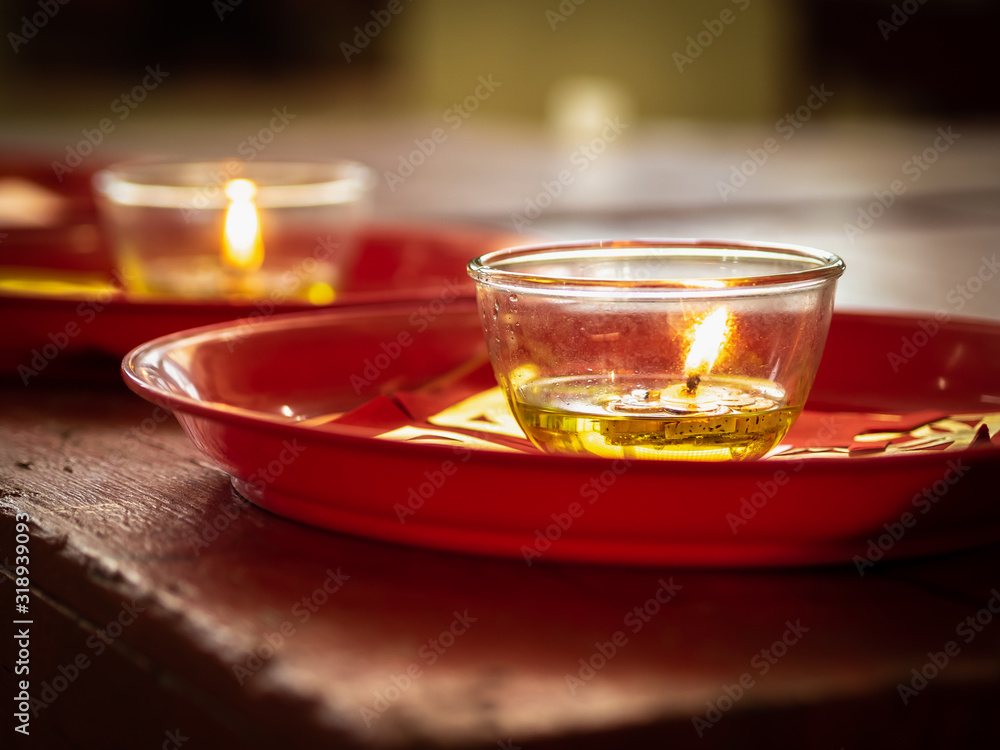 Candles in glass cups and joss papers Candles in glass cups and joss papers