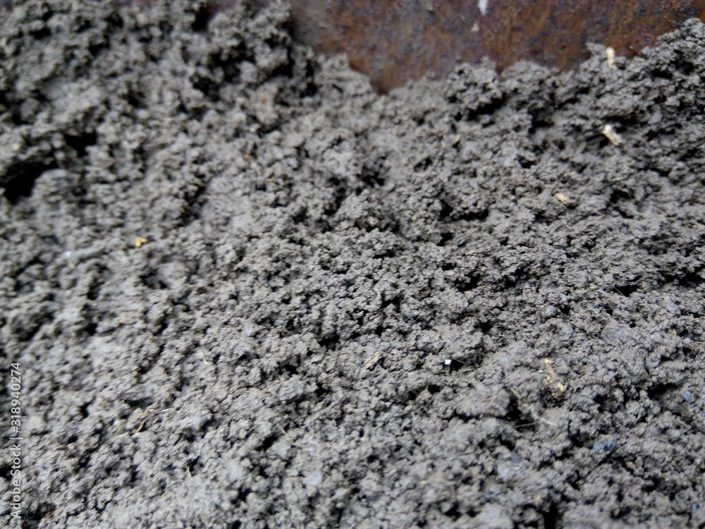 Black texture or background of the earth closeup Black texture or background of the earth closeup