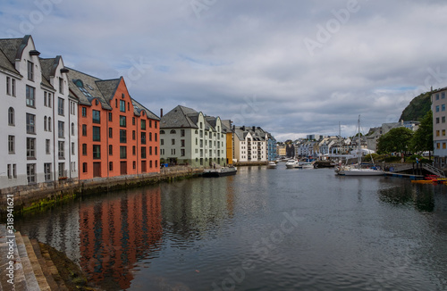 Picturesque summer view of Alesund port town on the west coast of Norway  at the entrance to the Geirangerfjord. Colorful morning cityscape. Traveling concept background.