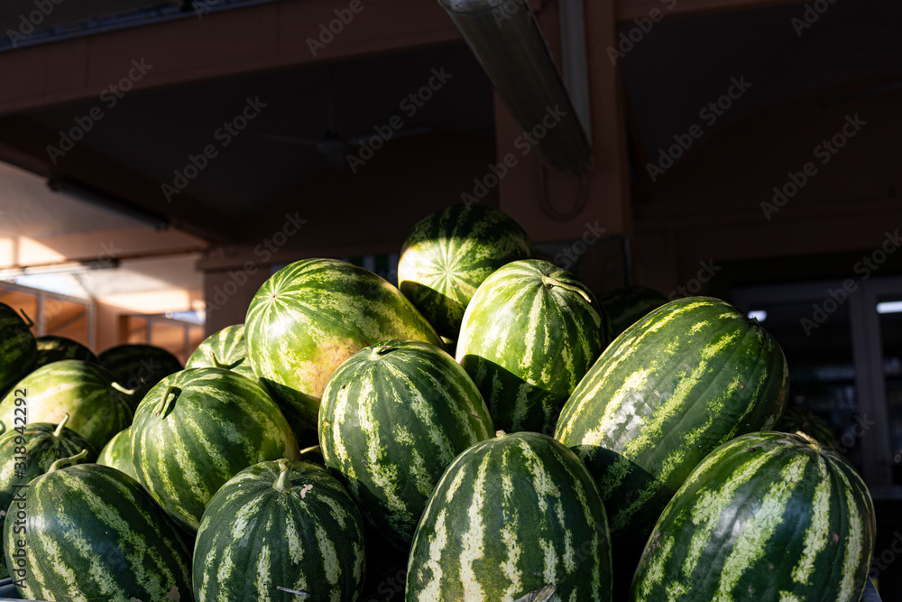 Lots of watermelons in a street market
