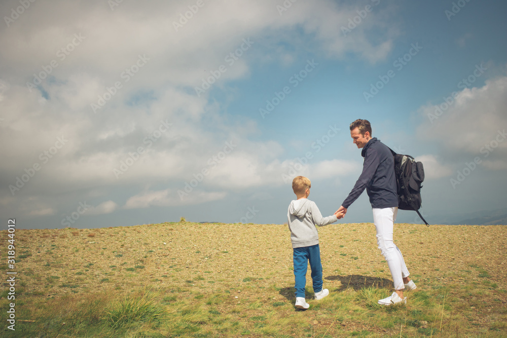 Father and son talking while spending day nature. Father and son talking while spending day nature.