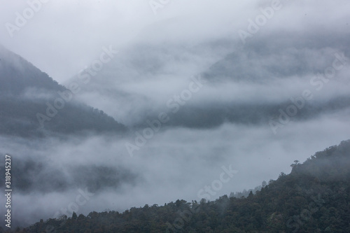 Fototapeta Naklejka Na Ścianę i Meble -  Clouds and fog at Doubtfull Sound. Fjordland New Zealand. South Island.