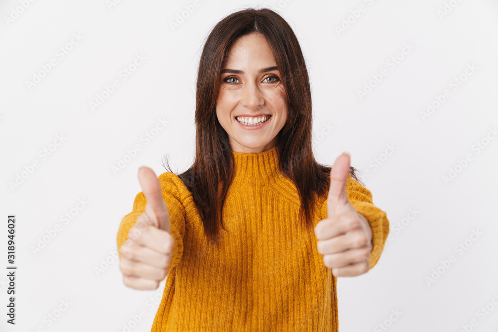Image of beautiful brunette adult woman smiling and showing thumbs up Image of beautiful brunette adult woman smiling and showing thumbs up