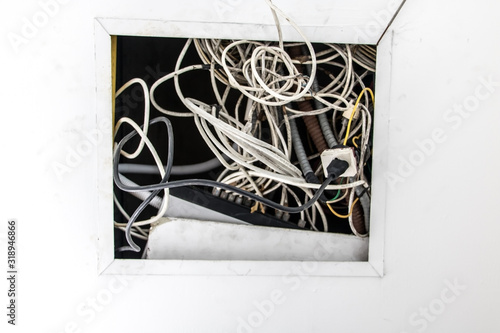 Canvastavla Electrical installation, wires stick out of the hole in the ceiling construction