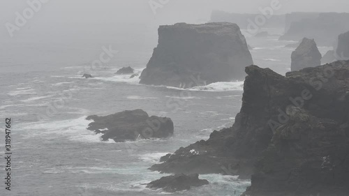 Sea stacks and cliffs in the mist at Eshaness / Esha Ness, peninsula in Northmavine on the island of Mainland, Shetland Islands, Scotland, UK photo