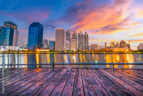 Panorama view of Benchakitti Park, Cityscape of skyscraper business reflection at Benchakitti park at twilight time in Bangkok, Thailand.